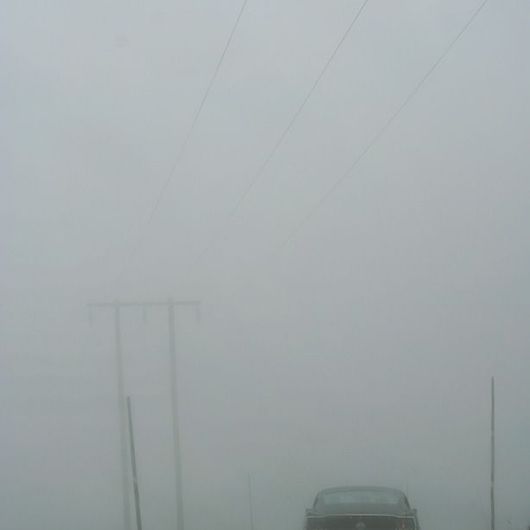Фотообои арт. DM302-1 Mr. Perswall с изображением машины мчащейся по пустынному шоссе в густом тумане. Купить фотообои  Mr. Perswall в Москве, большой ассортимент, оплата онлайн, бесплатная доставка