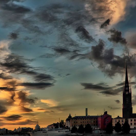 Фотообои Stockholm skyline, Mr. Perswall с панорамным изображением Стокгольма на закате. Выбрать, заказать фотообои для стен в салонах ОДизайн, большой ассортимент.