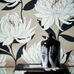 Заказать обои в прихожую арт. 112130 дизайн Sebal из коллекции Salinas от Harlequin, Великобритания с изображением хризантем белого цвета на блестящем серо-коричневом фоне с листьями черного цвета  в салоне обоев Odesign, недорого