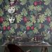 Английские флизелиновые обои Cole & Son® Fornasetti Senza Tempo Арт.114/1001 в интерьере кабинета . Дизайн изображает монохромных обезьянок, сидящих на зеленых ветвях, и срывающих спелые алые гранаты, на темном фоне.