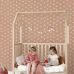 Детские обои с ромашками для игровой Daisies terracotta pink арт. 131117 — уютный и игривый узор для стен.