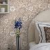 Интерьер розовой спальни декорированный шведскими обоями Dagmar с  мелким узором из цветов и птиц