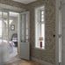 Цифровое панно для коридора Rosenvinge Grand Dark Beige, арт 9733W от Borastapeter – репродукция старейших обоев, найденных в Швеции, в увеличенном масштабе. Декоративные цветочные узоры представлены в мягкой естественной цветовой гамме с зелеными и абрикосовыми деталями на бежево-зеленом фоне. Закажите эти изысканные обои в интернет-магазине ODesign. Бесплатная доставка по всей России.