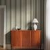 Цифровое панно для коридора Stockholm Stripe Green, арт. 9791W от Borastapeter, классические полосатые обои в увеличенном масштабе. Полосы разной ширины четырех разных оттенков придают строгому ритму узора живость и представлены в различных оттенках антично-зеленого и кремово-белого, подчеркнутые узкой терракотовой полосой. Эти полосатые обои идеально подойдут для детской, спальни, кухни или прихожей, создавая динамичную атмосферу. Заказать их можно в интернет-магазине ODesign с бесплатной доставкой по всей России.