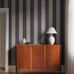 Цифровое панно для прихожей Bjärö Stripe Purple&Beige, арт. 9794W от Borastapeter, — это смелые графические обои с широкими полосами — классика с изюминкой в бежево-льняном и приглушенно-синем цветах — элегантная, сдержанная цветовая палитра. Эти полосатые обои идеально подойдут для детской, спальни, кухни или прихожей, создавая динамичную атмосферу. Заказать их можно в интернет-магазине ODesign с бесплатной доставкой по всей России.