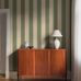 Цифровое панно для прихожей Bjärö Stripe Beige&Green, арт. 9797W от Borastapeter, — это смелые графические обои с широкими полосами — классика с изюминкой в мягкой, гармоничной цветовой комбинации: темно-зеленый и кремово-белый — элегантная, сдержанная цветовая палитра. Эти полосатые обои идеально подойдут для детской, спальни, кухни или прихожей, создавая динамичную атмосферу. Заказать их можно в интернет-магазине ODesign с бесплатной доставкой по всей России.