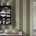 Цифровое панно для кухни Bjärö Stripe Beige&Green, арт. 9797W от Borastapeter, — это смелые графические обои с широкими полосами — классика с изюминкой в мягкой, гармоничной цветовой комбинации: темно-зеленый и кремово-белый — элегантная, сдержанная цветовая палитра. Эти полосатые обои идеально подойдут для детской, спальни, кухни или прихожей, создавая динамичную атмосферу. Заказать их можно в интернет-магазине ODesign с бесплатной доставкой по всей России.