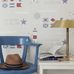 Обои Marstrand с композицией из морской символики в интерьере комнаты подростка. Выбрать обои для детской, столовой, большой ассортимент.