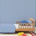 Интерьер детской спальни для мальчиков в морской тематике с синими обоями в полоску