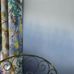 Фрагмент фотопанно в интерьере спальни арт. PDG1059/03  из коллекции Mandora от Designers Guild, Великобритания с градиентной растяжкой в бело-синих тонах. Приобрести  в салоне обоев в Москве, онлайн оплата