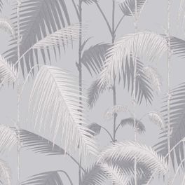 Обои Palm Jungle от Cole & Son - это пышный многослойный мотив из густой листвы джунглей в  серых оттенках на текстурированном блестящем серебристом фоне. Обои для гостиной, спальни. Купить обои в салоне, большой ассортимент, бесплатная доставка.
